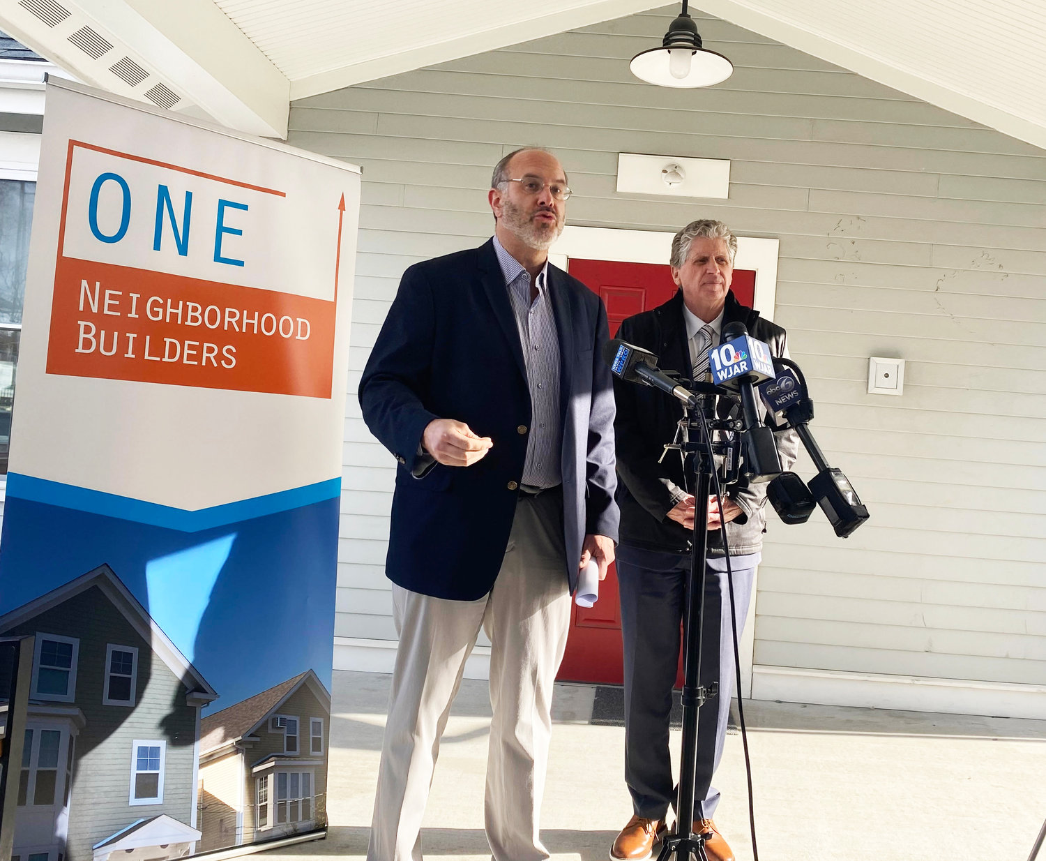 Housing Secretary Stefan Pryor and Gov. Dan McKee at a media availability held on Tuesday, Feb. 7, at a ONE Neighborhood Building Housing development.